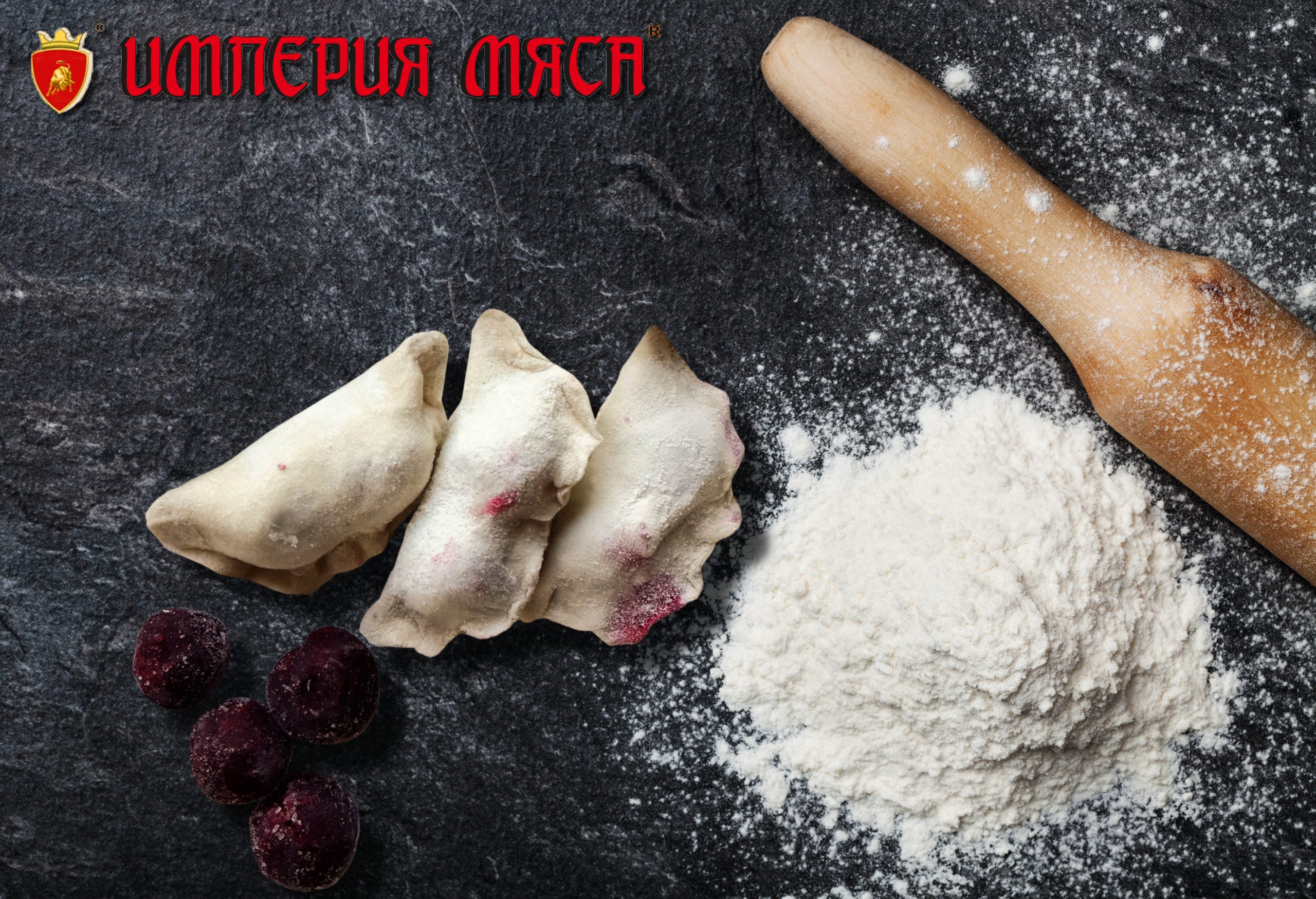 Baking desk with flour and rolling pin, top view, space for text